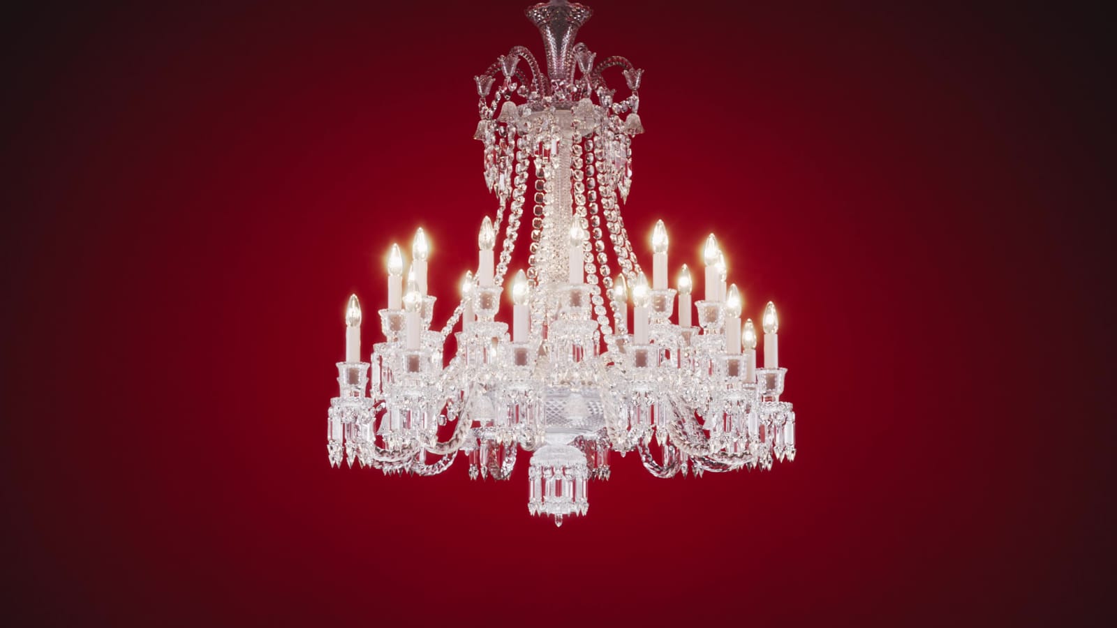 Zenith chandelier lit against red, CGI film still